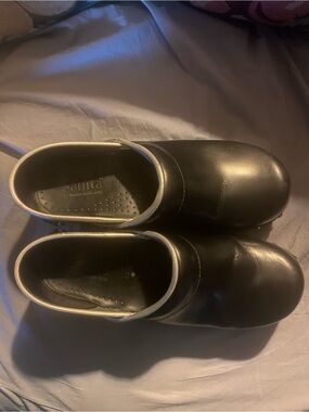 Sanita Black Leather Slip-On Clogs with White Trim